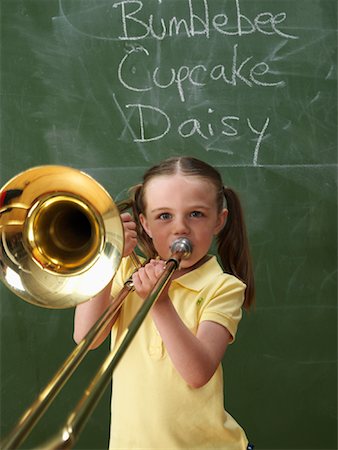 Girl in Classroom with Trombone Foto de stock - Con derechos protegidos, Código: 700-01646369