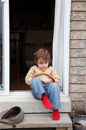 Boy with Whistle on Doorstep Foto de stock - Con derechos protegidos, Código: 700-01670787