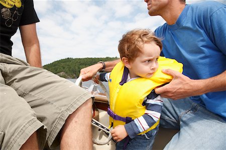 Boy on Boat with Adults Stock Photo - Rights-Managed, Code: 700-01670804