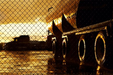 Transport Trucks Behind Fence Foto de stock - Con derechos protegidos, Código: 700-01694334