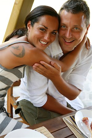 Portrait of Couple Holding Each Other at Table Stock Photo - Rights-Managed, Code: 700-01694487