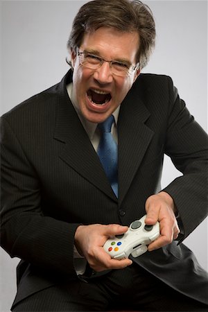 Businessman Playing Video Game Stock Photo - Rights-Managed, Code: 700-01694494