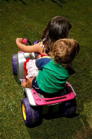 family on grass top view - Children on Toy Four-Wheeler Stock Photo - Rights-Managed, Code: 700-01694491