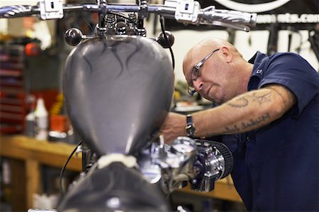 simsearch:700-00430285,k - Mechanic Working on Motorcycle Stock Photo - Rights-Managed, Code: 700-01694811