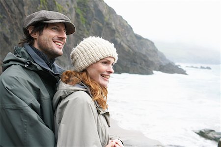 raincoat hugging - Couple Looking over Ocean, Ireland Stock Photo - Rights-Managed, Code: 700-01694931