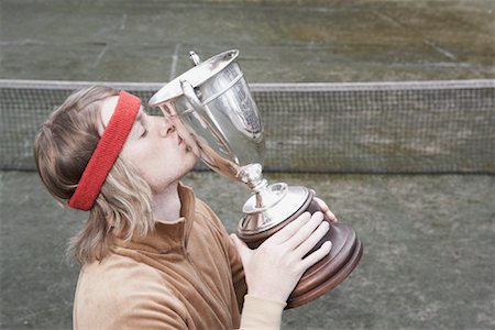 simsearch:700-01695220,k - Portrait of Man Kissing Trophy Foto de stock - Direito Controlado, Número: 700-01695218