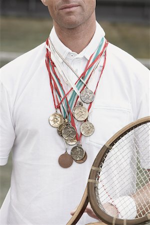 proud wearing a medal - View of Tennis Player's Chest with Medals Foto de stock - Con derechos protegidos, Código: 700-01695247
