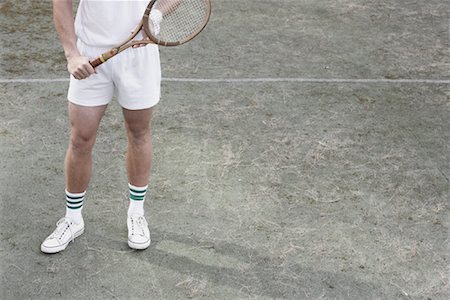 Vue sur les jambes du joueur de Tennis sur le Court de Tennis Photographie de stock - Rights-Managed, Code: 700-01695248