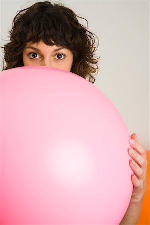 Woman Blowing Up Balloon Stock Photo - Rights-Managed, Code: 700-01716196