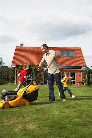 family home outside - Dad Mowing the Lawn While Kids Play Stock Photo - Rights-Managed, Code: 700-01716503