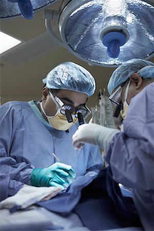 Médecins effectuant une chirurgie à cœur ouvert Photographie de stock - Rights-Managed, Code: 700-01716536