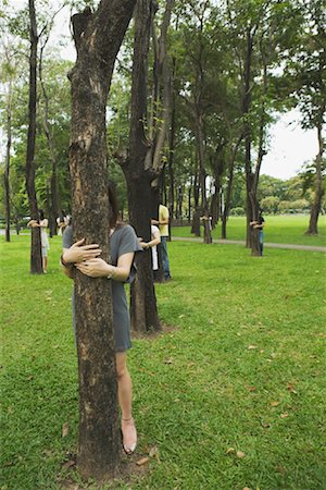 simsearch:700-03665027,k - People in Park Hugging Trees Stock Photo - Rights-Managed, Code: 700-01716681