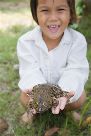 Girl Holding Frog Stock Photo - Rights-Managed, Code: 700-01716697