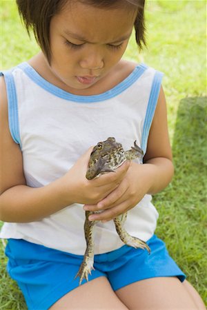 Girl Holding Frog Stock Photo - Rights-Managed, Code: 700-01716691