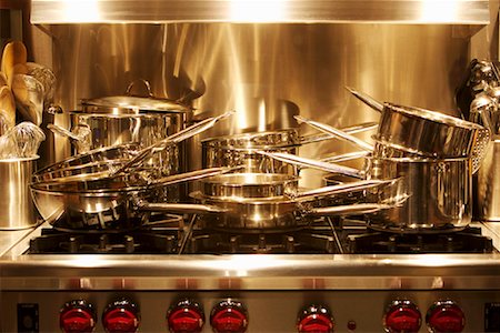 stainless steel pot - Pots and Pans Stacked on Stovetop Stock Photo - Rights-Managed, Code: 700-01716838