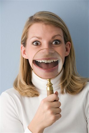 simsearch:700-02081910,k - Woman with Magnifying Glass in Front of Mouth Stock Photo - Rights-Managed, Code: 700-01717037