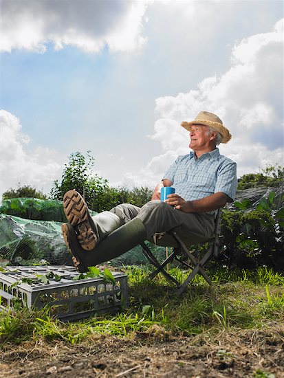 Mature Man Sitting on Chair Outdoors Stock Photo - Premium Rights-Managed, Artist: Masterfile, Image code: 700-01718046