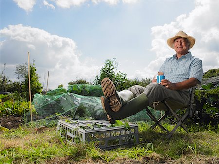 senior man in rubber boots - Portrait of Mature Man Sitting in Garden Stock Photo - Rights-Managed, Code: 700-01718047