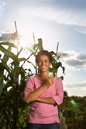 Portrait of Woman in Front of Corn Plants Foto de stock - Con derechos protegidos, Código: 700-01718062
