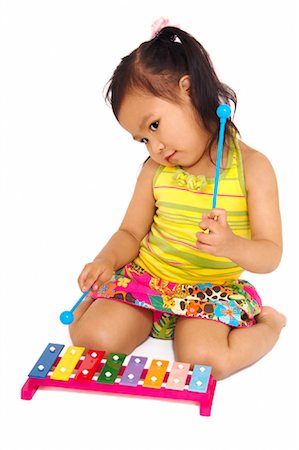 Child with toy instrument Fotografie stock - Rights-Managed, Codice: 700-01755627