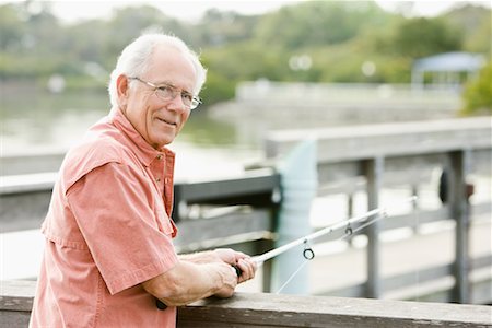 Man Fishing off Dock Stock Photo - Rights-Managed, Code: 700-01753630