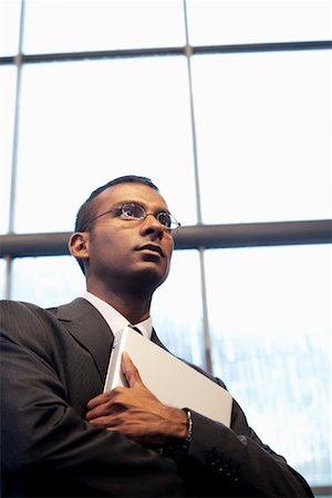 sri lankan brunettes - Businessman Holding Laptop Computer Stock Photo - Rights-Managed, Code: 700-01764194