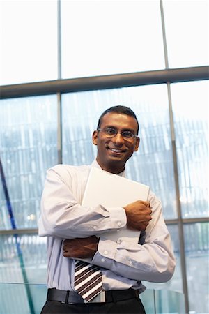 sri lankan brunettes - Businessman Holding Laptop Computer Stock Photo - Rights-Managed, Code: 700-01764193