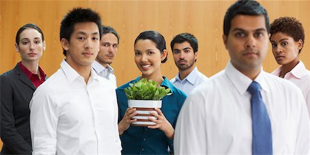 simsearch:700-01764255,k - Businesswoman in Group Holding Plant Stock Photo - Rights-Managed, Code: 700-01764239