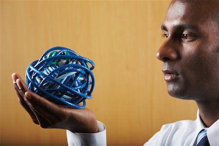 plug mess - Businessman with Ball of Ethernet Cables Stock Photo - Rights-Managed, Code: 700-01764261