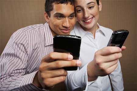 Man and Woman with Cellular Phones Stock Photo - Rights-Managed, Code: 700-01764278