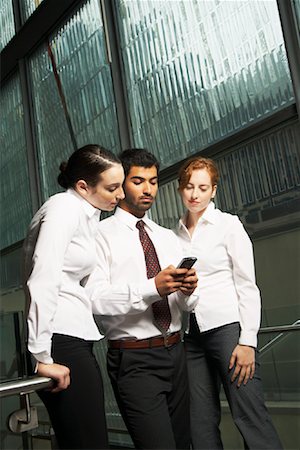 pictures of business people on their blackberry - Business People Looking at Electronic Organizer Stock Photo - Rights-Managed, Code: 700-01764282