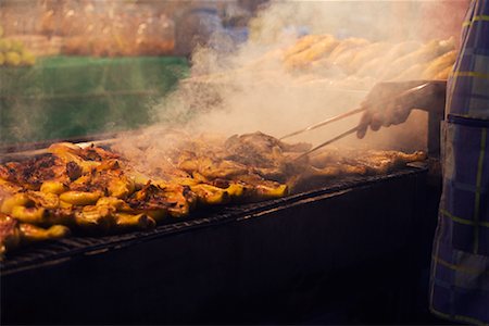 Street Vendor Cooking Chicken, Bangkok, Thailand Stock Photo - Rights-Managed, Code: 700-01764298
