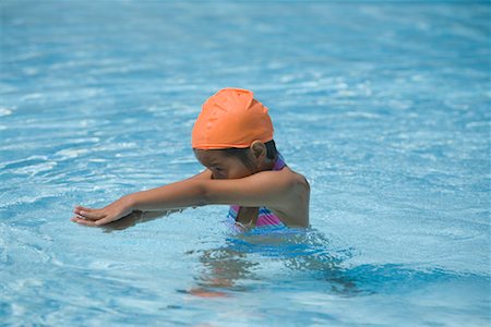 swimming pool and children and swim cap - Girl Learning to Swim Stock Photo - Rights-Managed, Code: 700-01764299