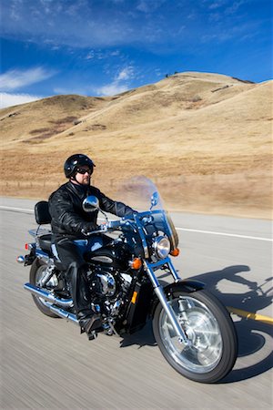 roy ooms - Man Riding Motorcycle Foto de stock - Con derechos protegidos, Código: 700-01764326