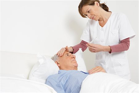 senior nursing home - Nurse Taking Patient's Temperature Stock Photo - Rights-Managed, Code: 700-01764483