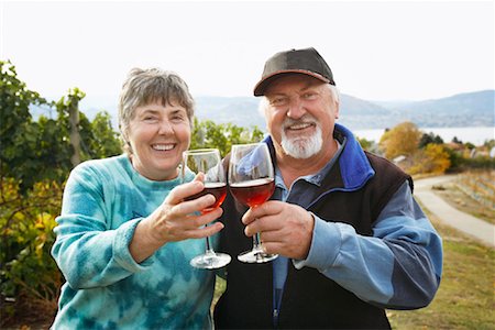 Couple in Vineyard, Raising Glasses of Wine Stock Photo - Rights-Managed, Code: 700-01764860