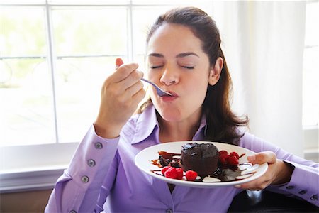 people eating baked goods - Woman Eating Dessert Stock Photo - Rights-Managed, Code: 700-01787471