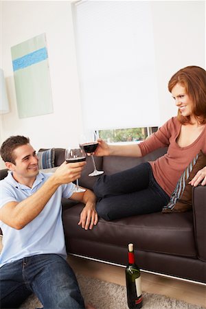 Couple Toasting in Living Room Stock Photo - Rights-Managed, Code: 700-01787653