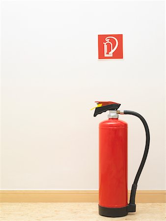 estintore - Fire Extinguisher Under Sign Fotografie stock - Rights-Managed, Codice: 700-01788260