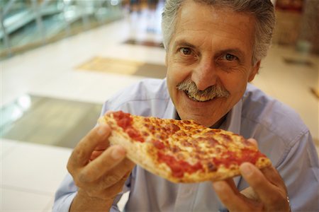 fast food restaurant inside - Man Eating Pizza Stock Photo - Rights-Managed, Code: 700-01788366