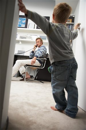 people annoying by phone - Child Waiting in Doorway of Man's Office Stock Photo - Rights-Managed, Code: 700-01827617