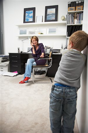 sitting sad boy - Child Waiting for Woman on Phone in Office Stock Photo - Rights-Managed, Code: 700-01827612