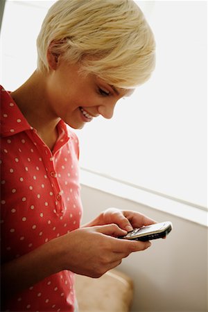 Woman Reading Text Message Stock Photo - Rights-Managed, Code: 700-01837458