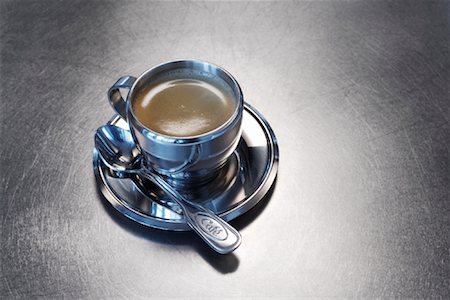 Still Life of Stainless Steel Espresso Cup and Saucer Stock Photo - Rights-Managed, Code: 700-01837722