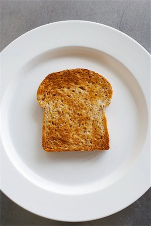 pan tostado - Piece of Toast on Plate Foto de stock - Con derechos protegidos, Código: 700-01837736