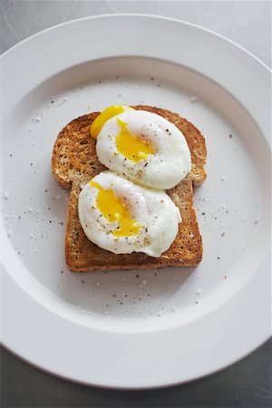 food on stainless steel - Poached Eggs on Toast on Plate Stock Photo - Rights-Managed, Code: 700-01837738