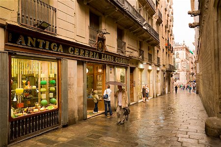 shops on a cobblestone street - Lane with Shops, Barcelona, Spain Stock Photo - Rights-Managed, Code: 700-01879625