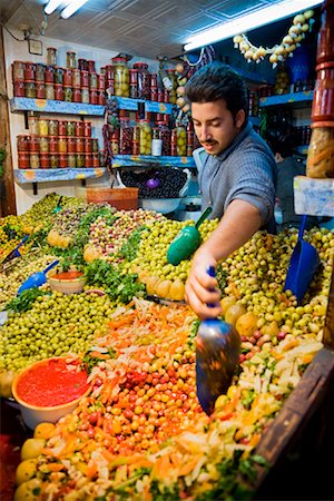 Man Selling Olives in Shop, Medina of Fez, Morocco Stock Photo - Rights-Managed, Code: 700-01879916