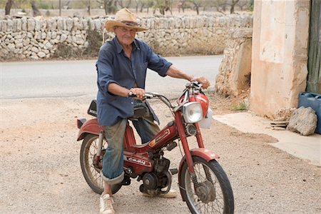 Portrait of Man on Moped, Mallorca, Spain Stock Photo - Rights-Managed, Code: 700-01954437