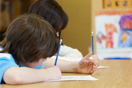 sneaking boy - Student Cheating on Test Stock Photo - Rights-Managed, Code: 700-01954524